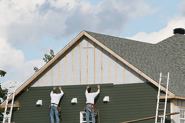 Professional Siding Installation technician working in Neptune Beach, FL